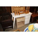 A white painted desk fitted three drawers