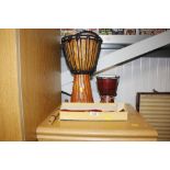 Two African style drums; a boxed recorder etc