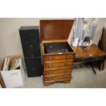 An Aiwa stereo in cabinet with two speakers