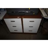 A pair of teak effect bedside chests fitted three