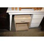 An oak effect bedside table fitted single drawer