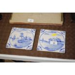 Two antique Delft tiles depicting church and other