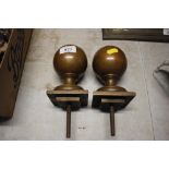 A pair of brass finials