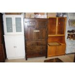 A carved oak and pitch pine linen press
