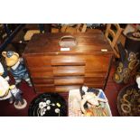 A desk top chest of drawers