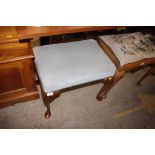 A cabriole legged dressing stool