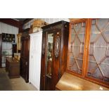 An early 20th Century oak mirrored door wardrobe