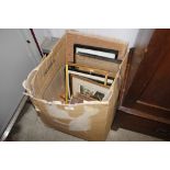 A box containing various pictures; frames etc