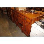 An oak sideboard fitted three drawers