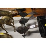 A set of three metal bird ornaments (118)