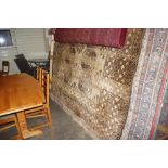 An approx. 12'4" x 8'7" brown patterned rug