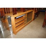 A beech effect TV stand with glass sliding doors