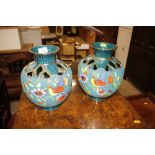 A pair of vases decorated with exotic birds