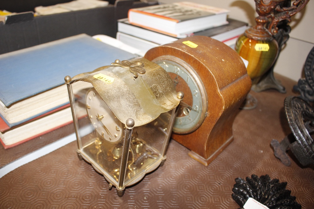 A mahogany cased striking mantel clock; and a bras