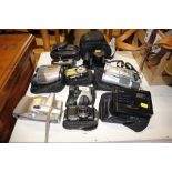 A quantity of various binoculars and cameras