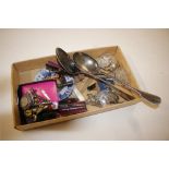 A box containing two silver plated sifter spoons,