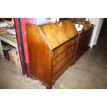 A walnut bureau fitted four drawers