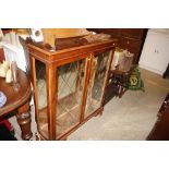 A reproduction yew wood effect display cabinet (on