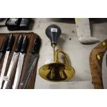 A brass car horn (88)