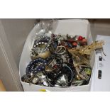 A box of various costume jewellery