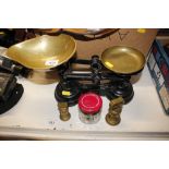 A set of kitchen scales and brass weights