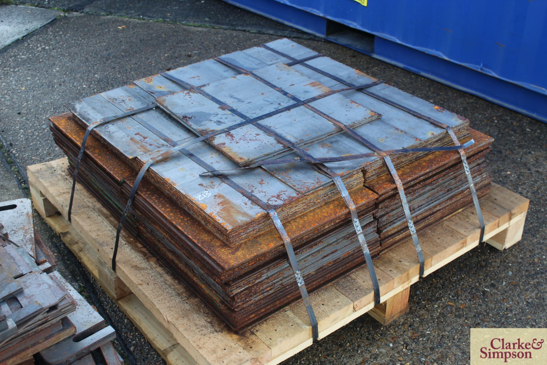 Pallet containing a quantity of steel plates.