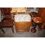 An Edwardian mahogany piano seat with drop down fr