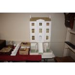 A dolls house and contents of various furniture an