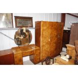 An Art Deco burr walnut three section wardrobe