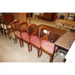 A set of four Victorian mahogany balloon back dining chairs