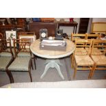 A part painted pine circular kitchen table on trip