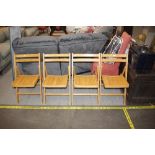 Four folding wooden kitchen chairs