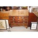 A George III mahogany bureau fitted two short and