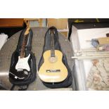 An acoustic guitar and travelling case