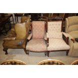 A late Victorian mahogany scroll back armchair