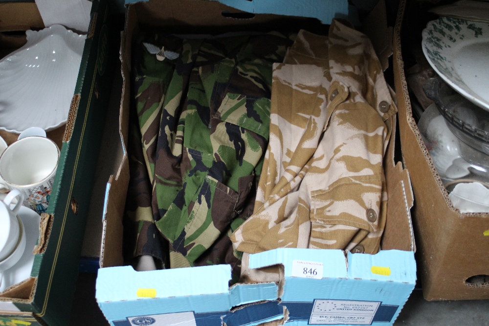 A box of military jackets and shirts