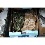 A box of military jackets and shirts