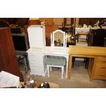 A white single pedestal dressing table fitted four