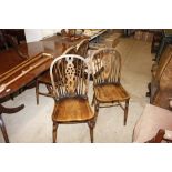 Four stick and wheel back dining chairs