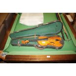 A violin and bow in fitted case