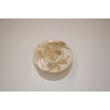 A Chinese ivory circular box and cover decorated t