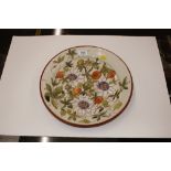 A Studio pottery shallow bowl with fruit and flora