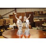 A pair of spelter bronze cherub figures