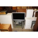 A Bravia flat screen television; a three tier tv s