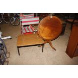 A teak effect table and a mahogany snap top table