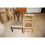 A mahogany Hepplewhite style dining chair; and an Edwardian cane seat bedroom chair