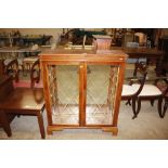 A reproduction yew wood effect display cabinet (one glass panel missing)