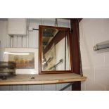 A bevel edged wall mirror