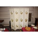 A painted wooden four fold boudoir screen