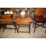 An antique oak side table, the overhanging top abo